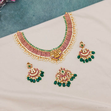 Versatile 2-in-1 Lakshmi kemp temple choker necklace set with detachable pendant, pearls and green beads. Perfect bridal jewellery for weddings and festivals.