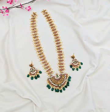 Kemp temple long necklace set
South Indian temple necklace set
Kemp bridal necklace with green beads
Temple jewellery haram necklace set
Antique temple necklace with earrings