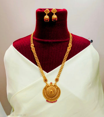 Antique long haram necklace set with ruby-colored stones