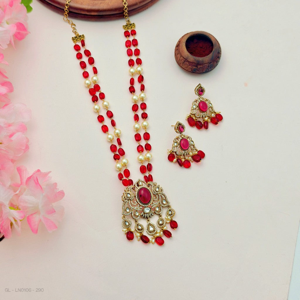 Kundan and pearl beaded necklace set with red stone accent