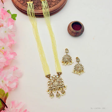 Traditional peacock-inspired necklace set with pearl drops