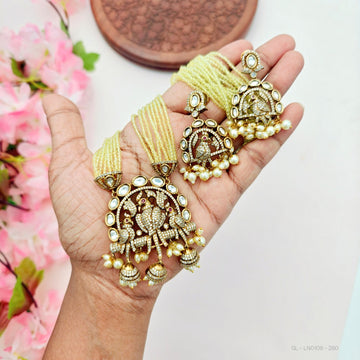 Traditional peacock-inspired necklace set with pearl drops