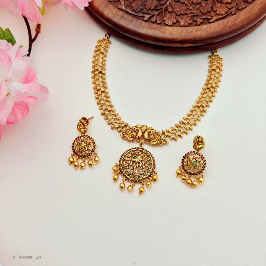 gold-plated peacock and elephant motifs set