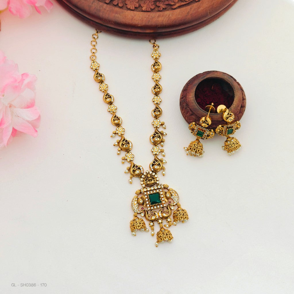 gold-plated peacock and elephant motifs set