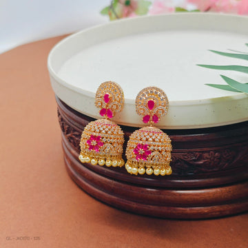 Gold plated AD pink stone floral design pearl jhumkas