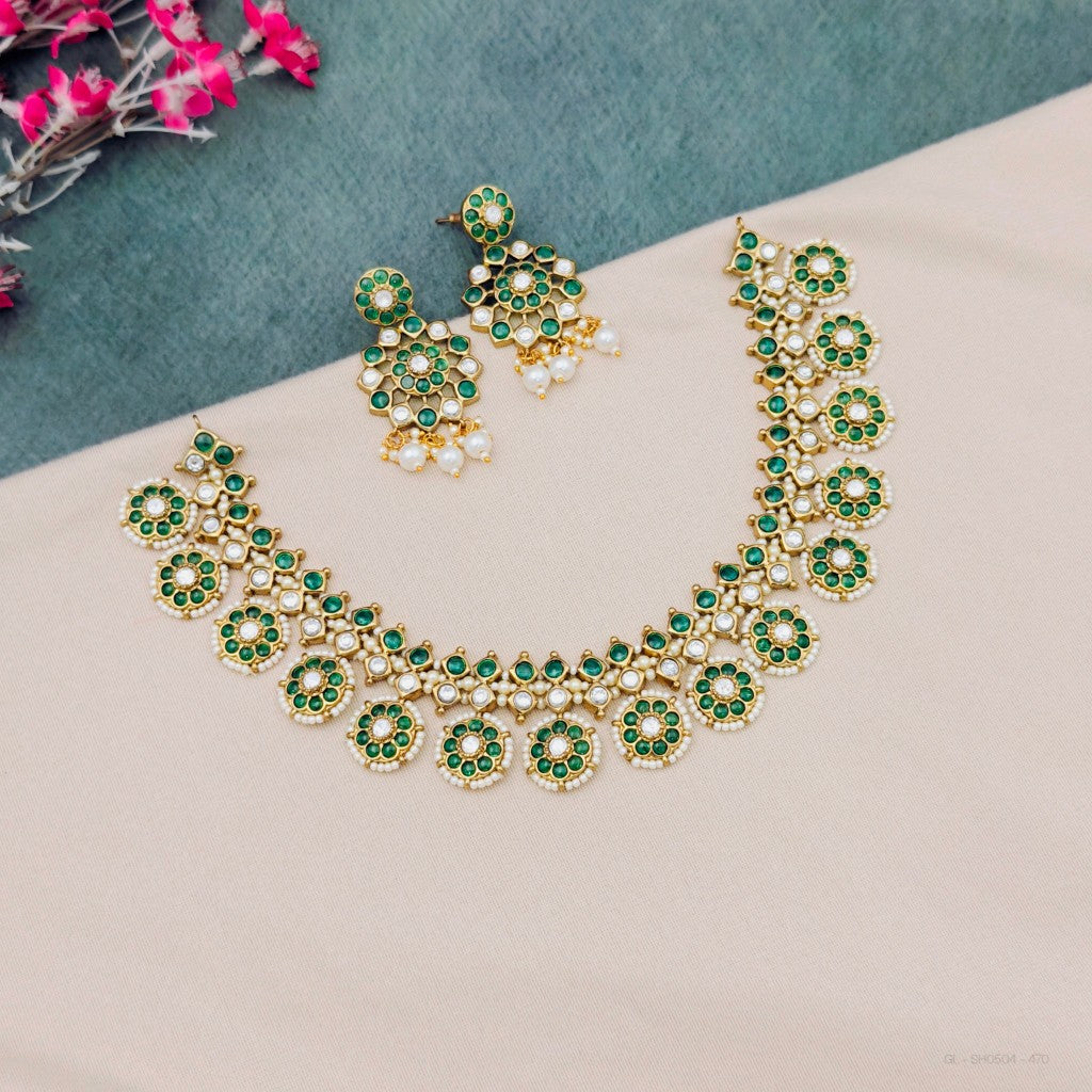 Green kundan temple necklace set with earrings
South Indian green kundan necklace set
Traditional green stone temple jewellery
Emerald green kundan bridal necklace set
Green kundan imitation jewellery necklace set