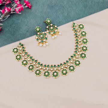 Green kundan temple necklace set with earrings
South Indian green kundan necklace set
Traditional green stone temple jewellery
Emerald green kundan bridal necklace set
Green kundan imitation jewellery necklace set