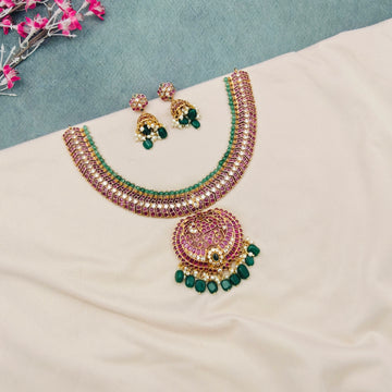Lakshmi kemp temple choker necklace set
South Indian temple choker jewellery set
Ruby kemp Lakshmi pendant choker necklace
Traditional bridal temple choker set
Temple jewellery choker with green beads