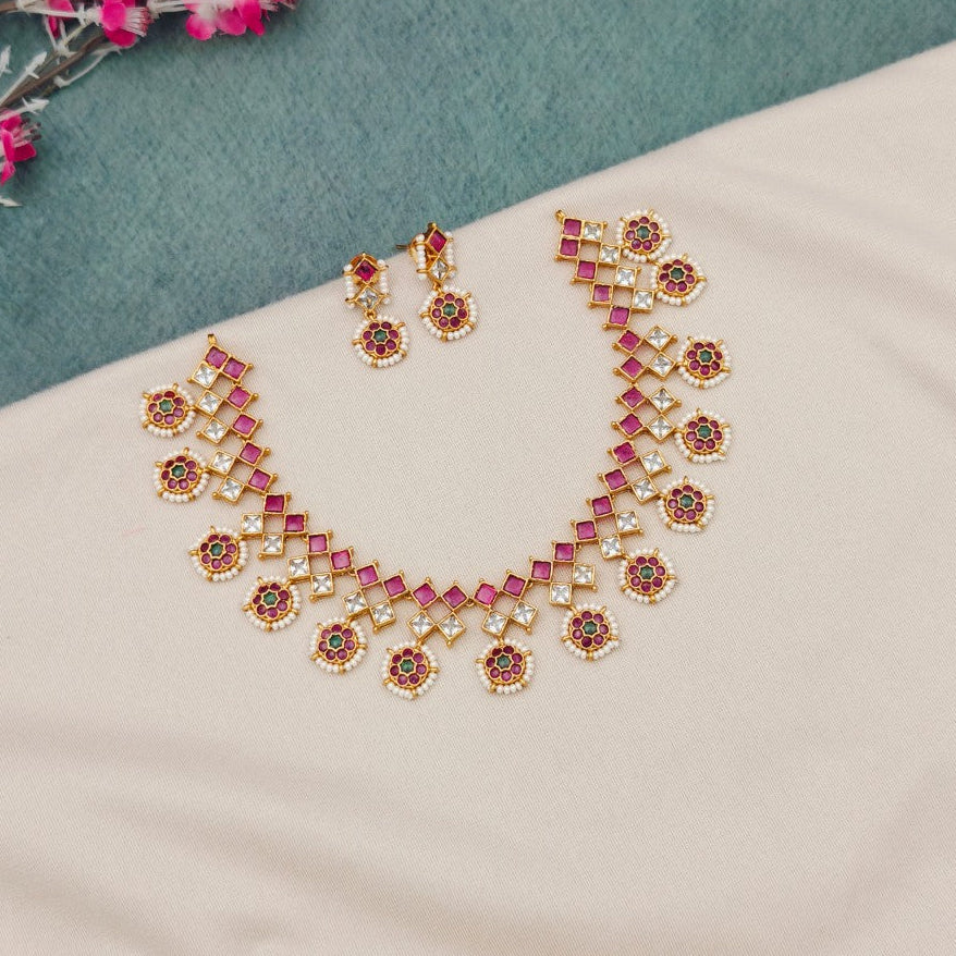 Pink stone temple necklace set with earrings
South Indian pink temple jewellery necklace
Traditional pink stone imitation necklace set
Temple style pink kundan necklace set
Pink stone bridal temple jewellery set