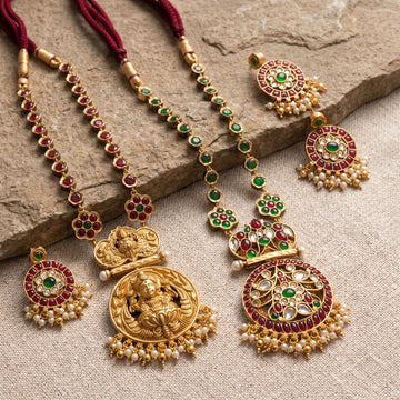 Detailed close-up of reversible temple jewellery set laid on textured surface, highlighting craftsmanship and realistic reflections.